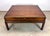 A large and impressive campaign style mahogany and brass coffee table by Theodore Alexander circa late 20th century....
