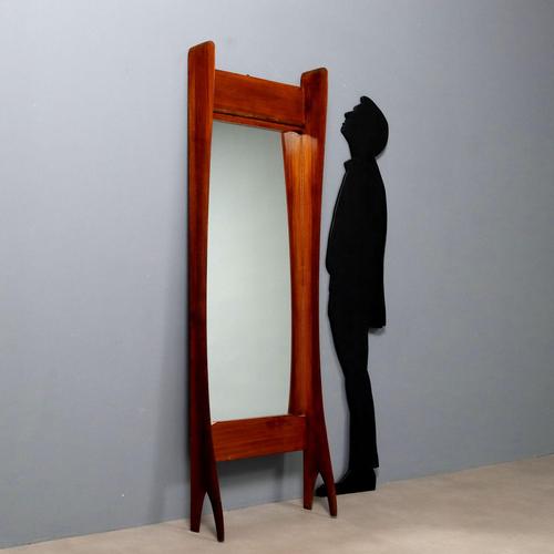 Entrance furniture with mahogany veneered wooden structure and rectangular vertical mirror. This piece is attributed to...