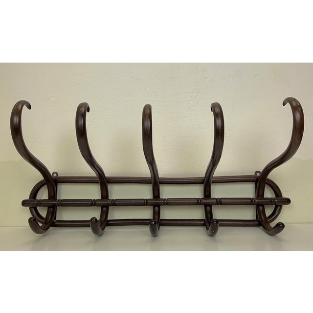 Antique beech wood coat rack with beautiful curls in the style of Thonet. with beautiful patina and the good old look, in...