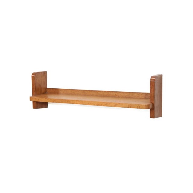 Beautiful wall shelf made of oak with upright side panels. The shelf can be mounted flush to the wall and can be used in...