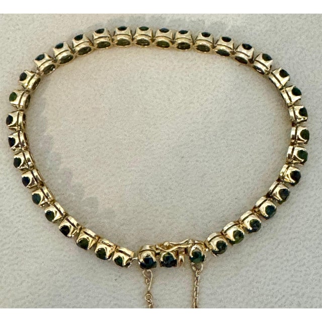 It is a vintage piece This exceptionally Beautiful Tennis bracelet has 38 stones of Round shape Green Tourmalines . Total...