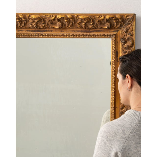 This mirror carries genuine presence, its gold gilt ornate carved frame, rectangular immediately setting the tone for the...