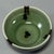 This antique Chinese Longquan celadon bowl features attractive dark splashed spots over the soft green glaze, with natural...