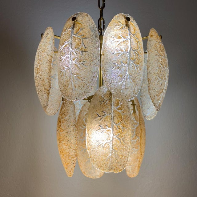 The absolutely fantastic vintage murano glass chandelier made in italy in the 1980s. consists of 12 glass plates of murano...