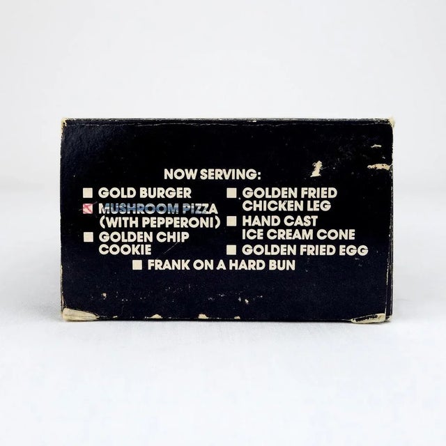 The original carton box reads 'Ted Arnold High Society Solid Fake Gold Cast Fast Food Emporium'. According to the same...