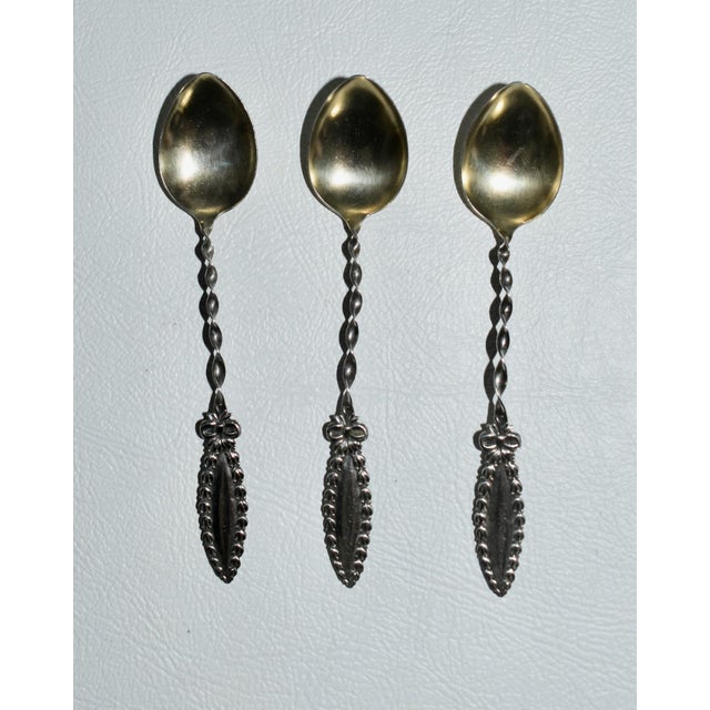 Antique (1920's) Set of Three Demitasse Spoons made of Sterling Silver. Twisted Handle. The Measurements: 3.5"W x .5"D x...