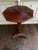 Elegant early 20th century Edwardian style mahogany wine table featuring a shaped octagonal top raised on a clean pedestal...