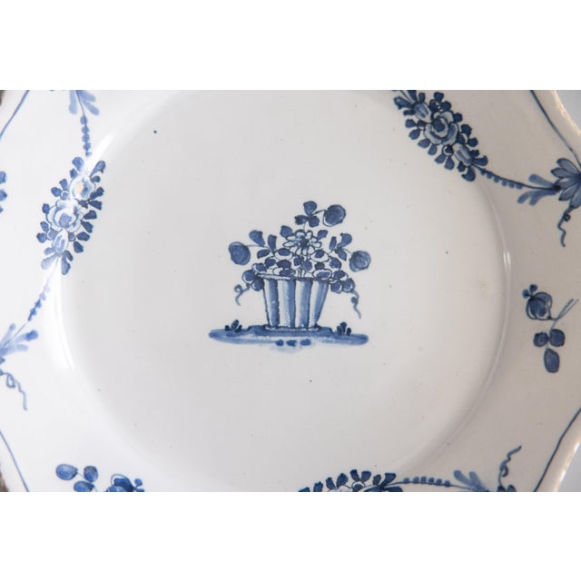 A lovely antique 18th-Century French faience Delft influenced scalloped floral plate from northern France. Hand painted...