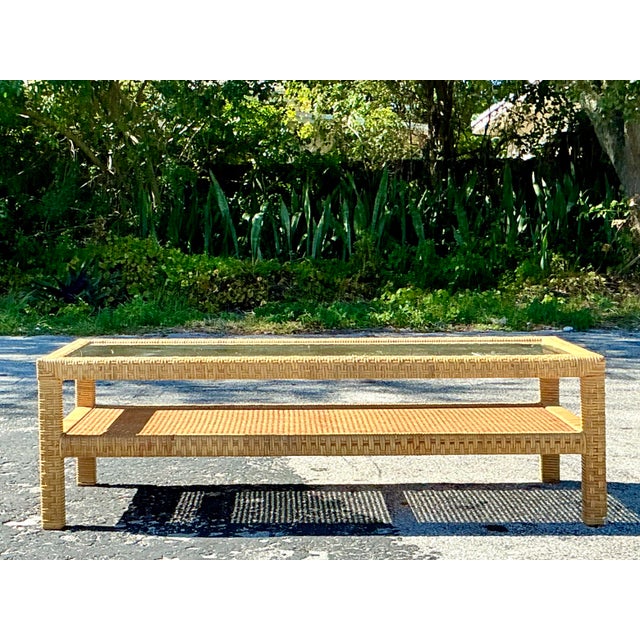 This vintage coastal coffee table beautifully captures the relaxed charm of seaside style with its woven rattan...
