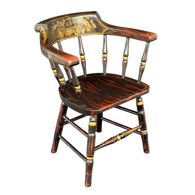 A fine American captain's chair featuring the traditional Federal-style stenciled details on a Windsor chair style frame -...