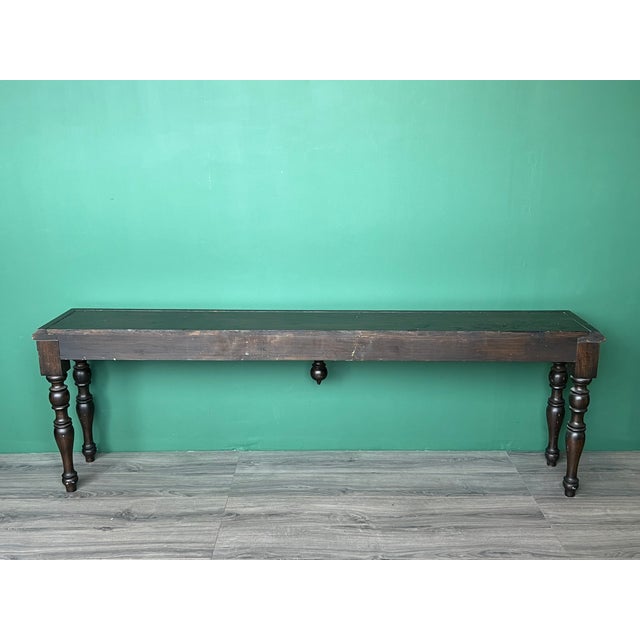 This is a solid built Spanish-Colonial style long console table with bras accent. This console has some marks and...