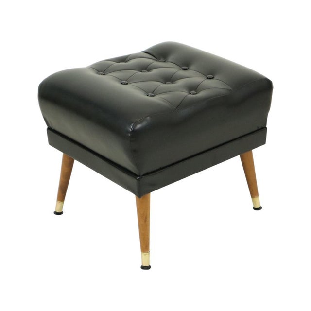 Nice vintage pouf upholstered in high-quality black faux leather (skai), with a tufted seat in the iconic Chesterfield...
