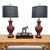 A matched pair of mid-century Chinese table lamps in hand-carved cinnabar lacquer, each formed as a tall baluster vase...