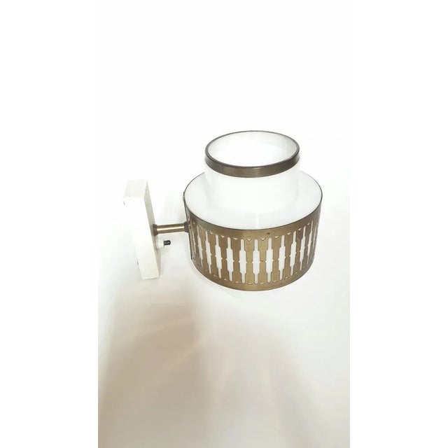 Rare wall light by Bent Karlby For Lyfa, 1967 Lyfa label on the socket In brass and white acrylic glass See photos and...