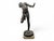 This refined bronze sculpture captures a moment of vivid, anecdotal realism, depicting a young naked fisherman caught in a...