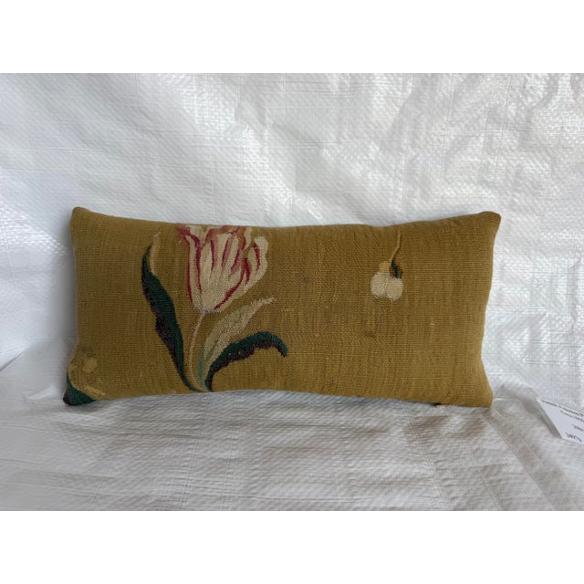 This elegant French Aubusson tapestry pillow, dating to circa 1850, features a beautifully restrained floral composition...