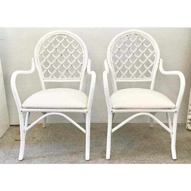 Fabulous pair of Ficks Reed arm chairs with new Todd Hase upholstery. Would make a great addition to your boho chic...