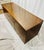 A sleek and understated Mid-Century Modern credenza featuring clean architectural lines, warm walnut-toned casework, and...