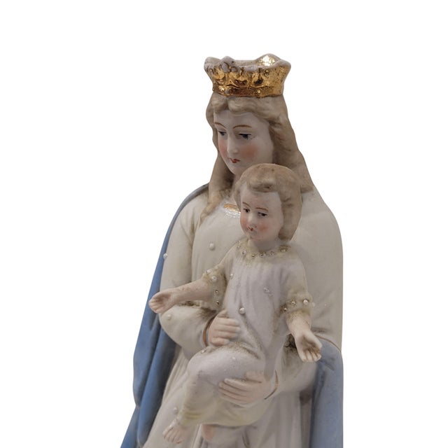 A beautiful Virgin and Child figurine made in Germany in the early 20th century. This unglazed bisque porcelain figurine...