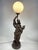Beautiful Liberty table lamp from the 1920s, depicting a woman with an amphora. Excellent furnishing object, fully...