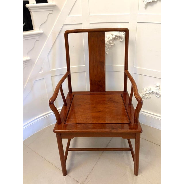 Unusual antique hardwood Chinese armchair having a delightful design with a shaped centre splat to the back and elegant...