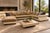 A monumental Roche Bobois sectional combining sculptural white leather framing with warm taupe-beige suede seating and...