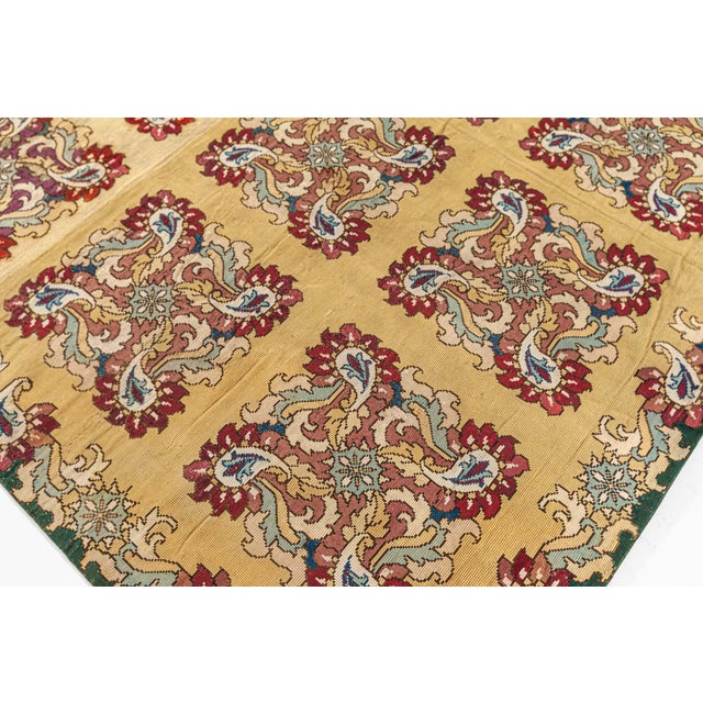 This exquisite antique English needlepoint rug from the 1890s is a quintessential example of Victorian craftsmanship and...