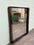 Rectangular mirror made in Italy in the 1970s. Walnut-stained wooden frame. It has two smoked glass side panels.
