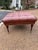 Old school charm at its best! This classic, tufted, oxblood leather ottoman elevates any space with nailhead trim and...
