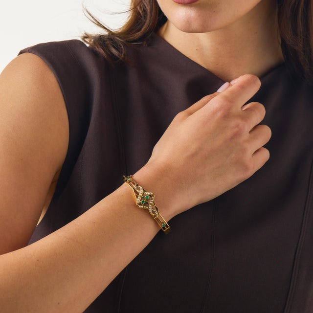 This beautiful Victorian bangle is a graceful antique jewel from the 1900’s, crafted in warm 14k yellow gold with a...