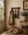 Early 20th century French faux bamboo coat and hat rack with four rounded pegs and warm honey-toned finish. Crafted in the...