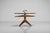 An exceptional and rare revolving side magazine table of unknown authorship, made in Italy 1950s. Yet crafted with a level...