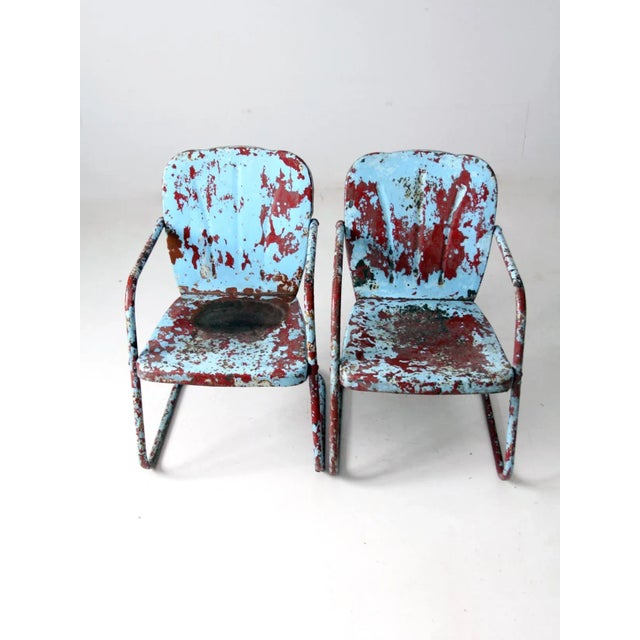 This pair of mid-century patio chairs embodies the classic Shott style, featuring distinctive bouncer frames and elegant...