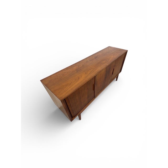 This listing is for a Mid-Century Modern Tambour Walnut 9-Drawer Dresser. Featuring a straight line design, rolling...
