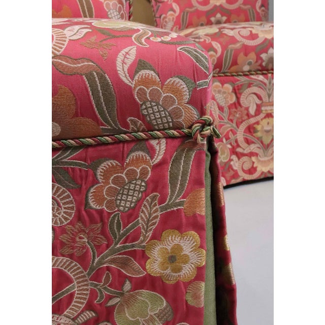 An elegant set of four matching upholstered slipper chairs, featuring gently flared backs and generously padded seats....