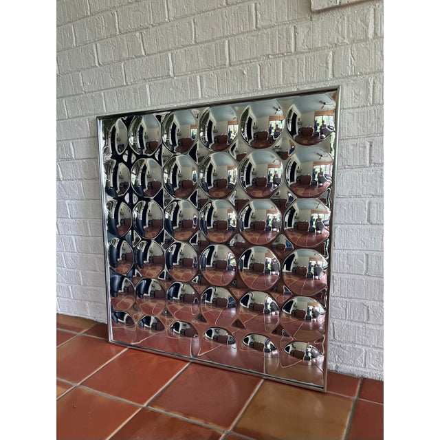 A mesmerizing optical design with convex circular forms set within a polished aluminum frame. Cratted from Plexiglas...