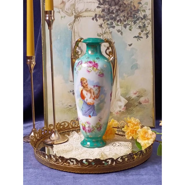 This exceptional antique late 19th-century Victoria Carlsbad Austrian porcelain amphora portrait vase masterfully captures...
