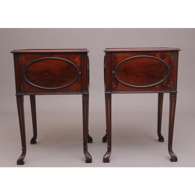 Pair mid 20th Century flame mahogany bedside cabinets in the Chippendale style, wonderful figured tops with a stepped...