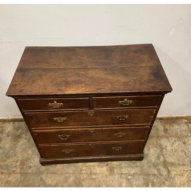 An extraordinary 18th century English oak chest of drawers, a piece that carries the quiet dignity of centuries of daily...