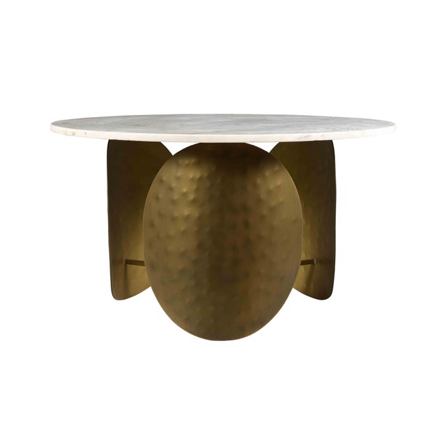 Hand-hammered antique brass ovals act as a solid base for a white marble top. Available in two sizes, this eye-catcher...