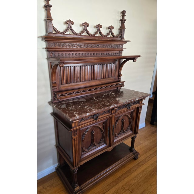 This is a highly detailed buffet cabinet by the famed French company Mercier Freres. It stands a majestic 81 inches tall,...