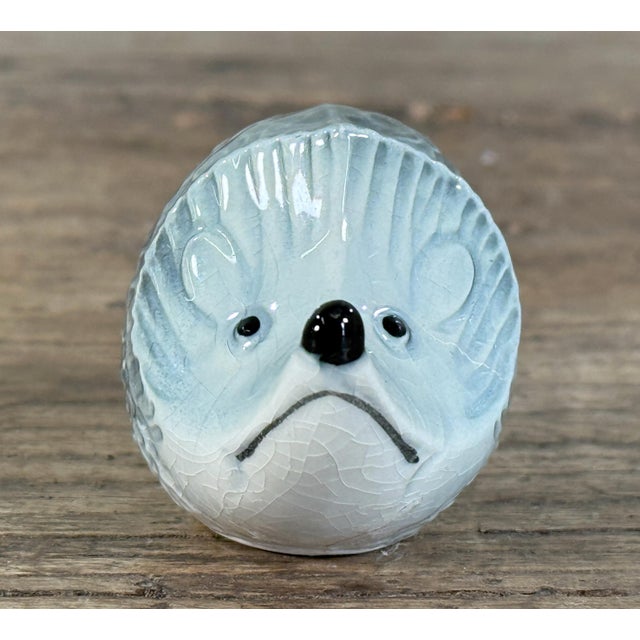 Charming vintage glazed ceramic hedgehog, likely mid-20th century, modeled with textured quill detailing and finished in a...