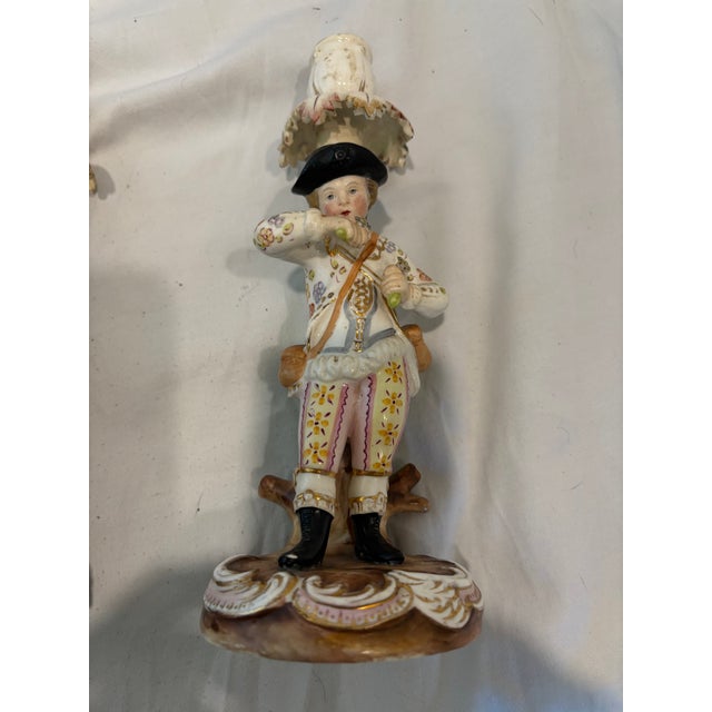 This unique pair of figural candlesticks was made by the French Sevres porcelain factory in the 19th C. The candlesticks...