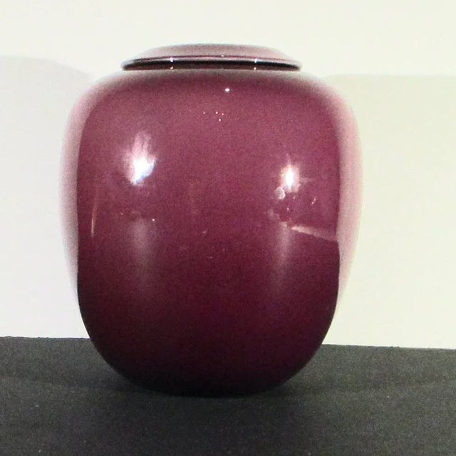 Beautiful plum color glass vase with rolled over rim. Classic 70s' home design. Rich color and wonderful weight and feel...