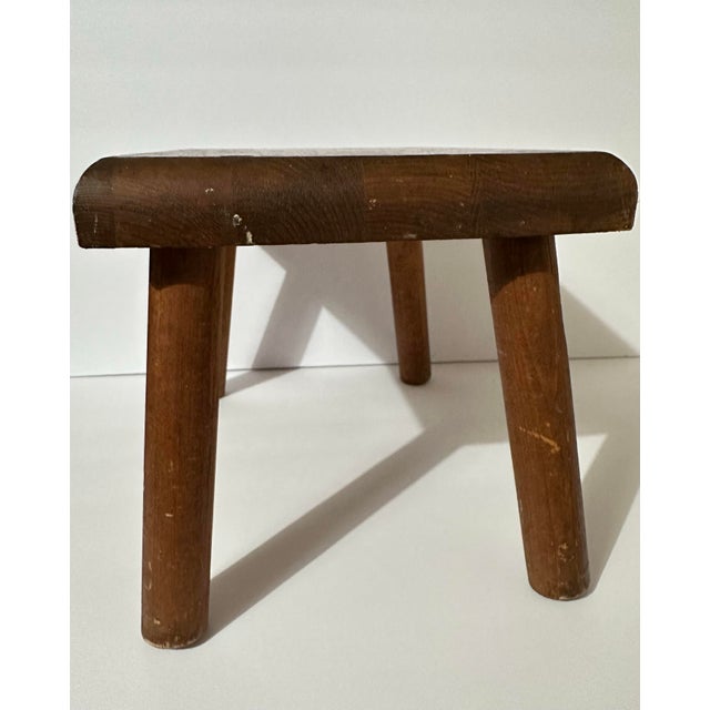 Vintage handcrafted folk art-style wooden footstool with decorative floral and rocking horse stenciling. The wear, simple...