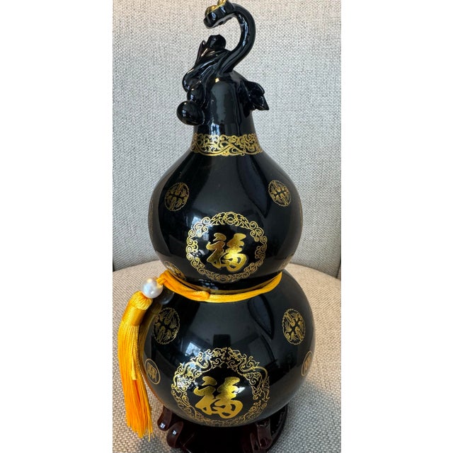 This exceptional Hulu gourd (Wu Lou) is masterfully hand-crafted from authentic natural Mount Taishan Black Jade, a rare...