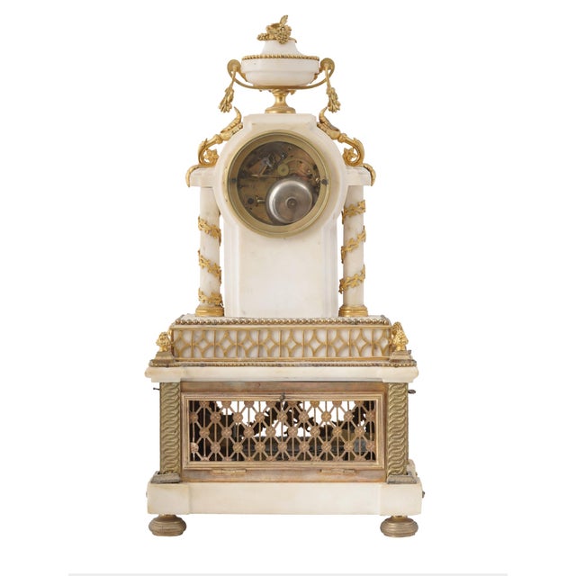 An exceptional antique French Linetaine Paris musical mantel clock, dating to the 19th century. This elaborate...