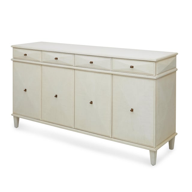 Each drawer and cabinet front of the Ames Credenza comes to a subtle pyramid point, a quiet geometric flourish that gives...