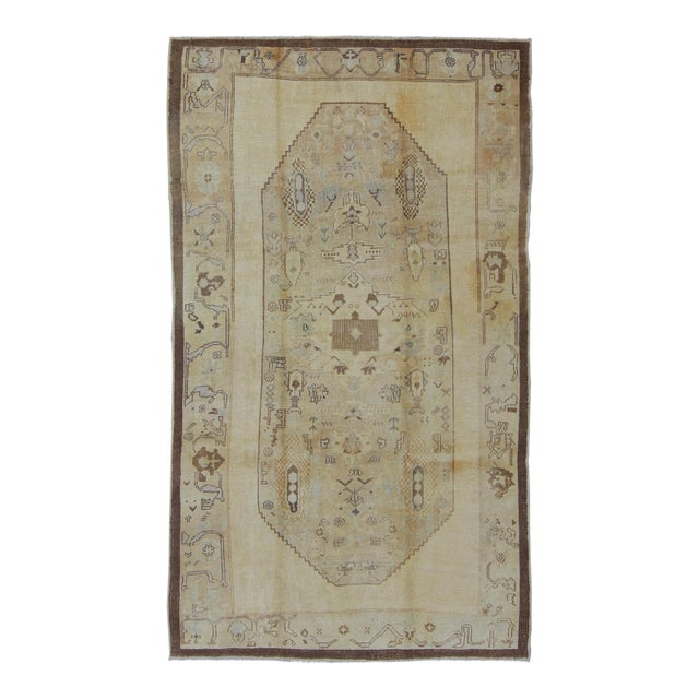 Vintage Turkish Oushak Rug Featuring Faded Camel, Ivory, and Pale Blue Accents For Sale