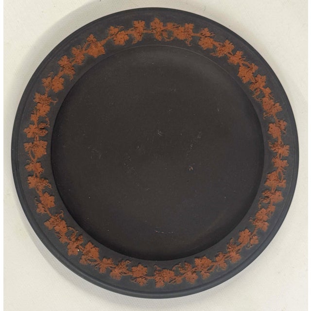 Antique 18th century Wedgwood rosso antico basalt plate with grape vine border. Measures 7 5/8" diameter. Unmarked. Good...